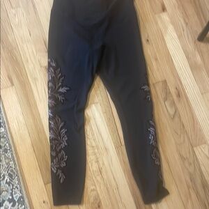 Athleta Black Elation High-Rise docked velvet leggings.